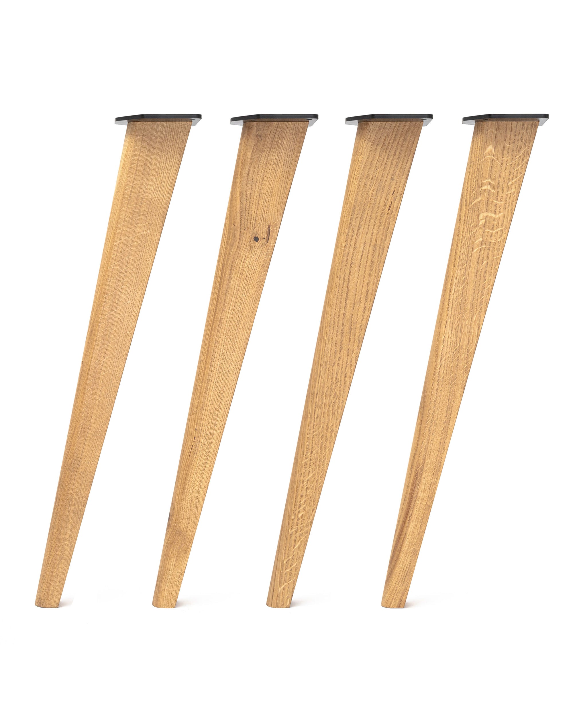 Set of four solid oak desk legs in a Scandi style, with a natural light finish and visible grain variation, each angled and fitted with black mounting plates.