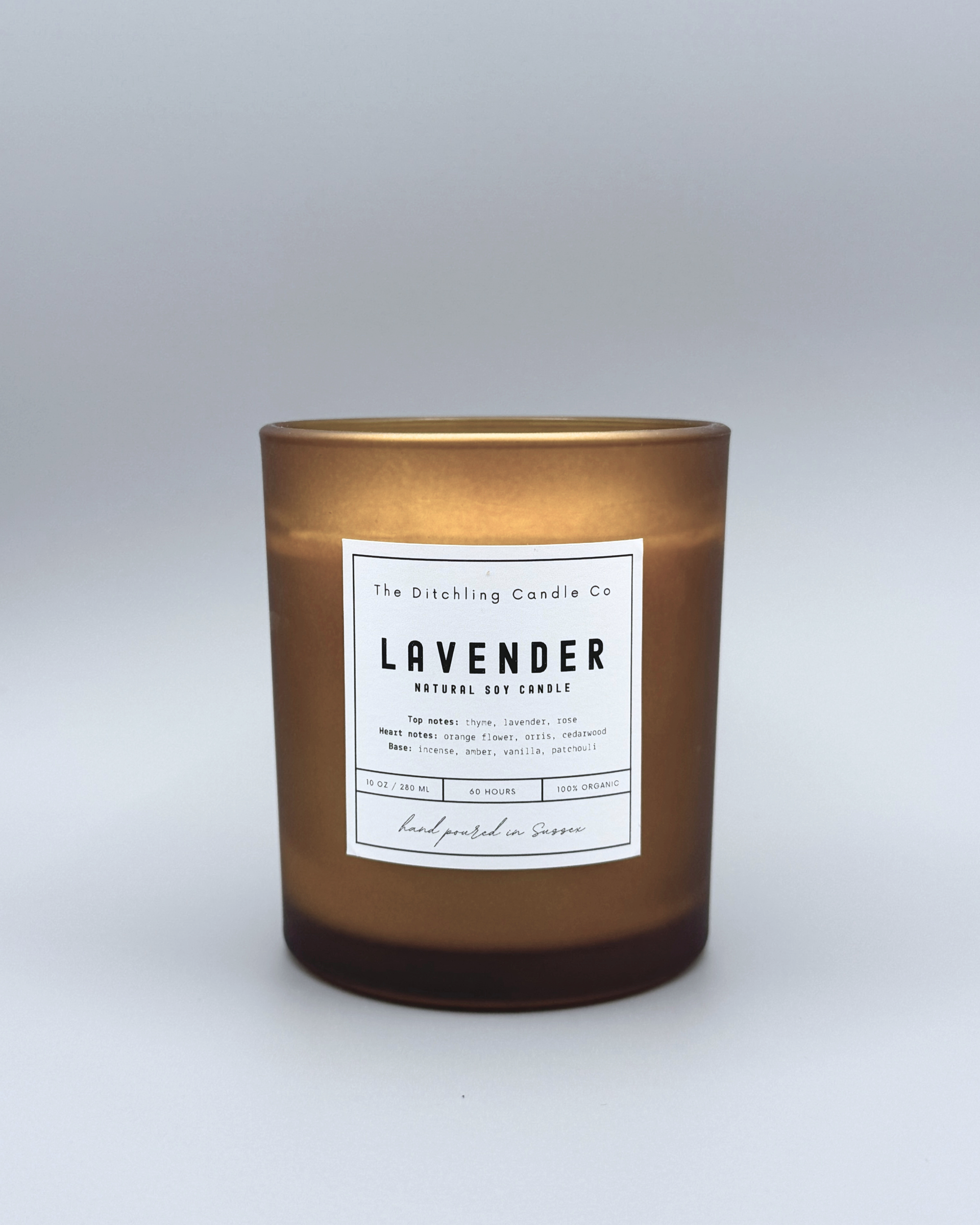 Natural soy, lavender scented candle in a 10oz amber glass, with white label and matt grey background. Top notes of thyme, lavender and rose. Heart notes of orange, flower, orris and cedarwood. Base notes of incense, amber, vanilla and patchouli. Finished with a wooden wick.