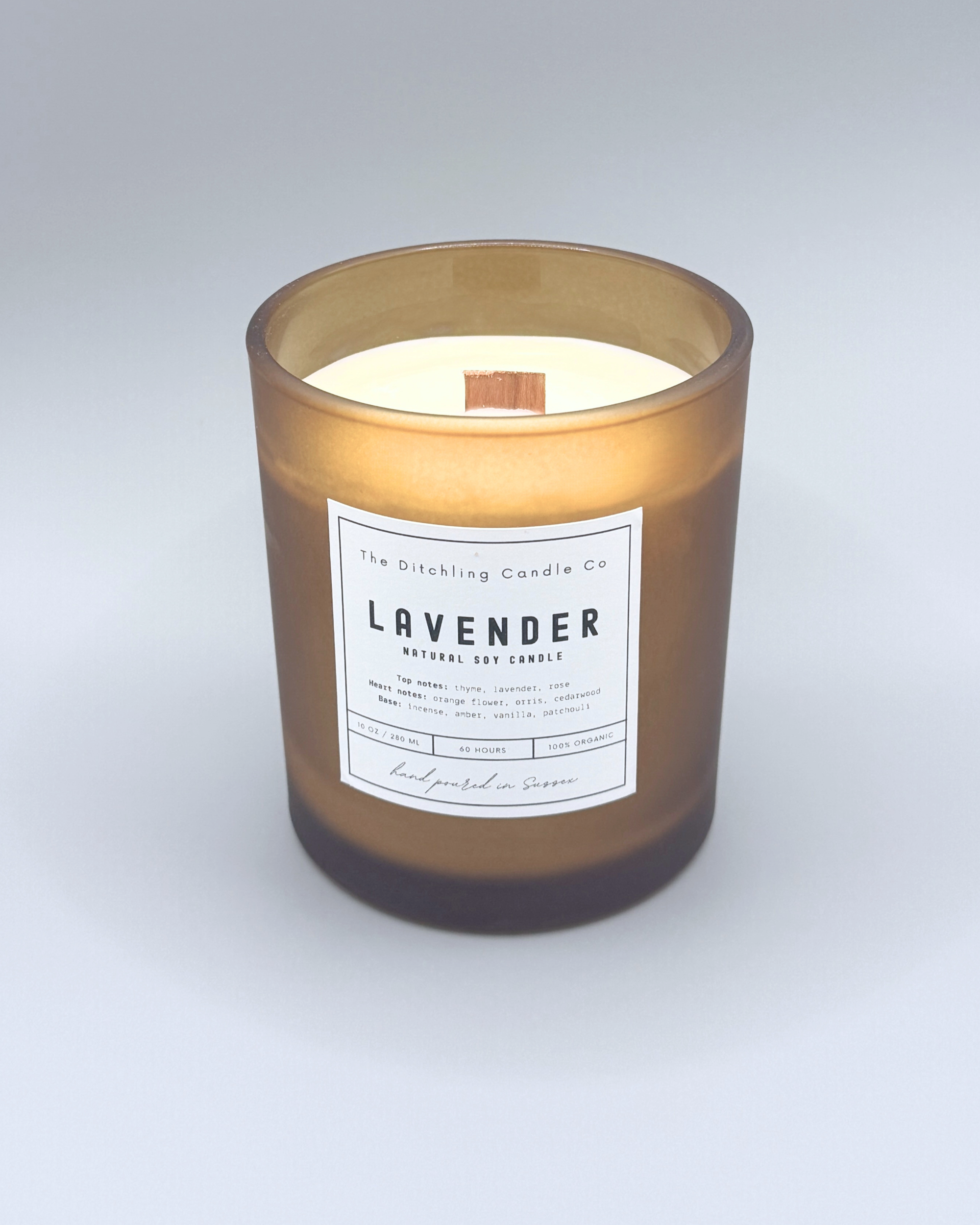 Natural soy, lavender scented candle in a 10oz amber glass, with white label and matt grey background. Top notes of thyme, lavender and rose. Heart notes of orange, flower, orris and cedarwood. Base notes of incense, amber, vanilla and patchouli. Finished with a wooden wick.